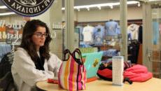 Student studying in front of the bookstore